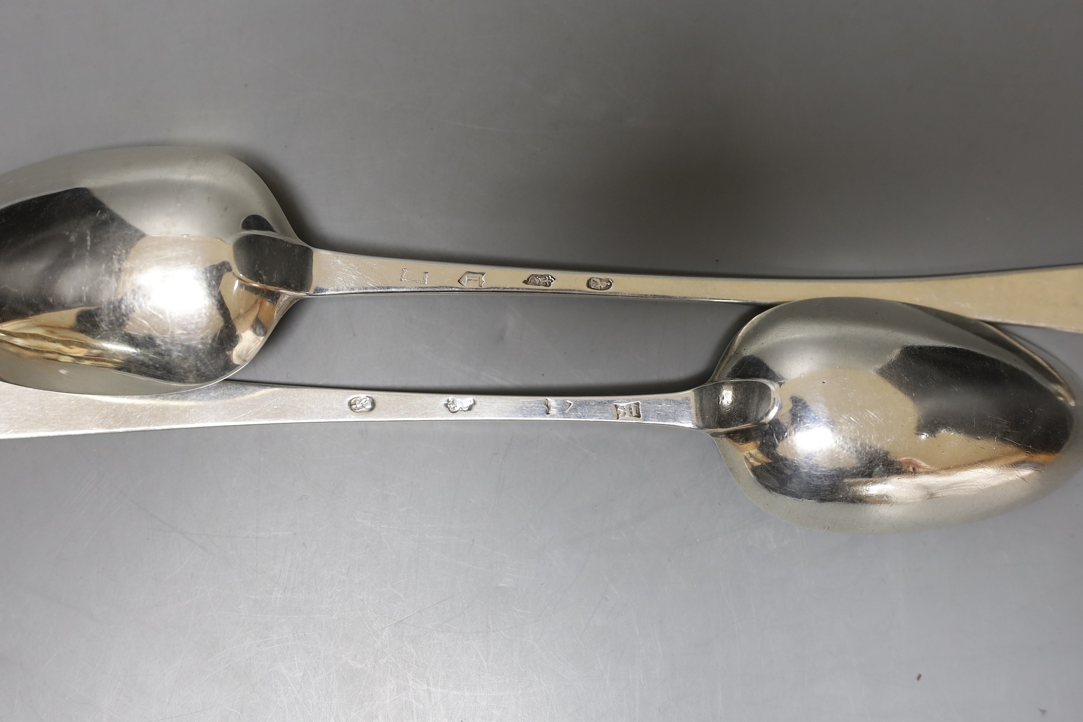 Two late 18th century Irish silver Old English feather edge basting spoons, one by James Keating and one dated Dublin, 1777, largest 31.3cm, 194 grams.